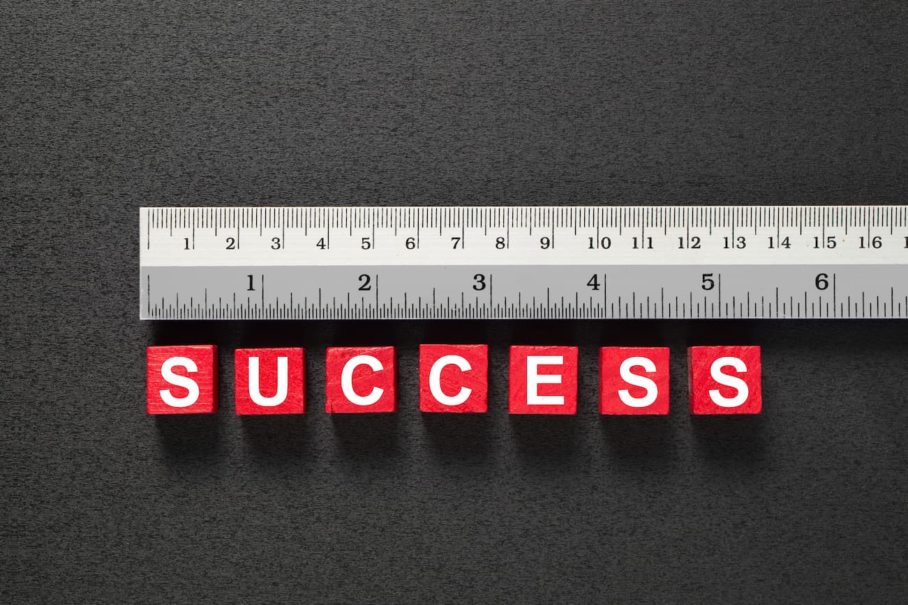 Section image - photo of a ruler with success spelled out next to it, being measured