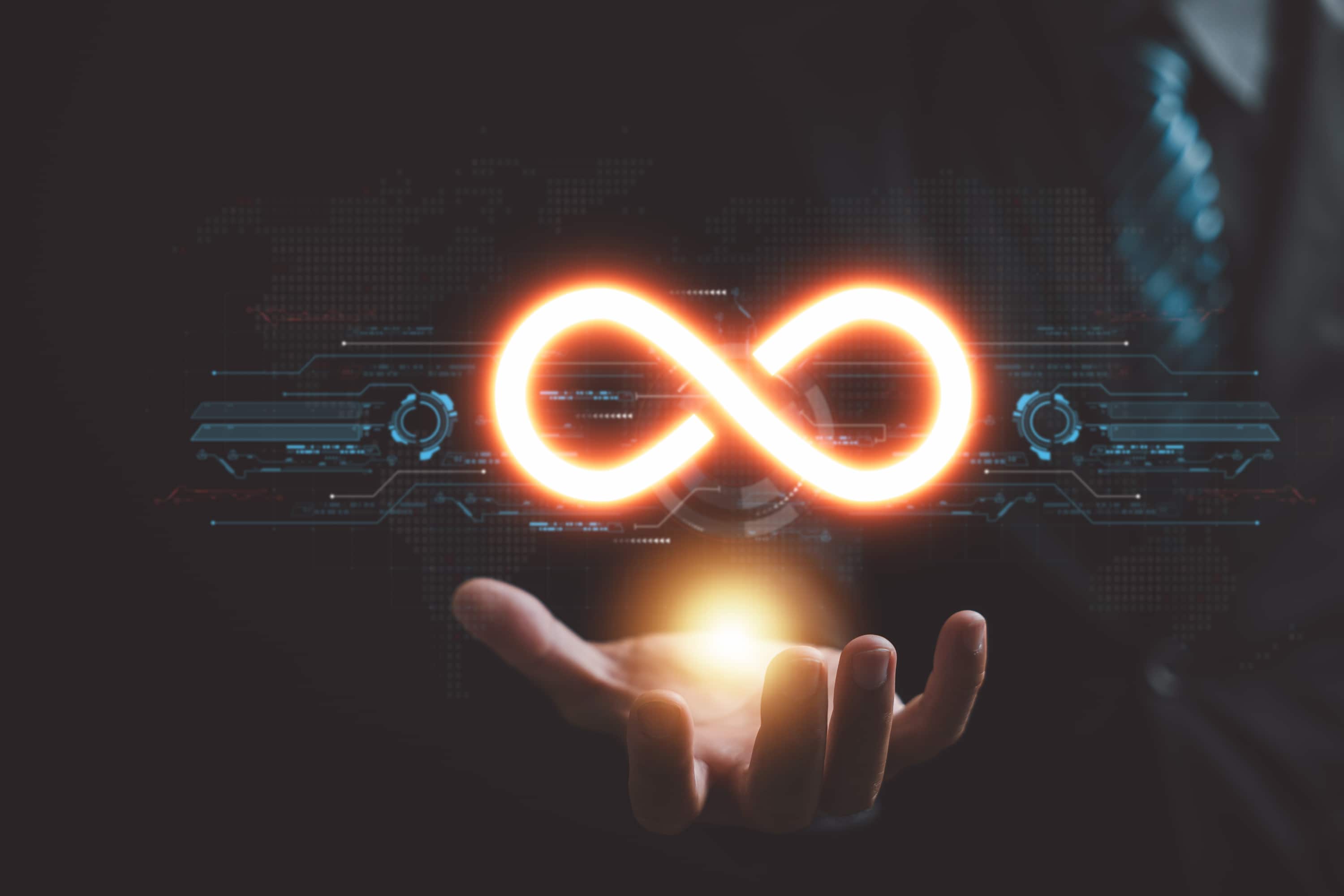 Section image - graphic of illuminated infinity symbol hovering above someone's hand